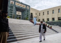 a lawyer walks past in front of the peshawar high court building photo afp