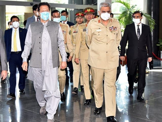 a file photo of pm imran and gen qamar during their visit to the isi secretariat in islamabad