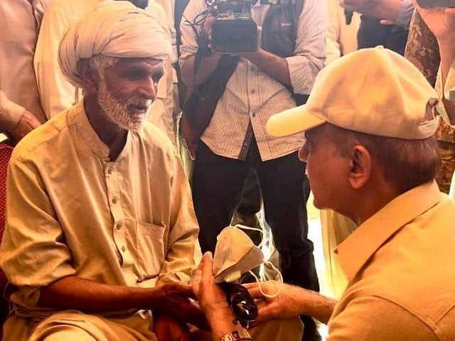 pm shehbaz sharif takes feedback from an elderly citizen on the mechanism regarding distribution of free flour during his visit to dera ghazi khan photo express