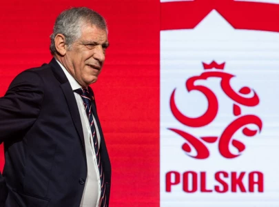 santos named poland coach