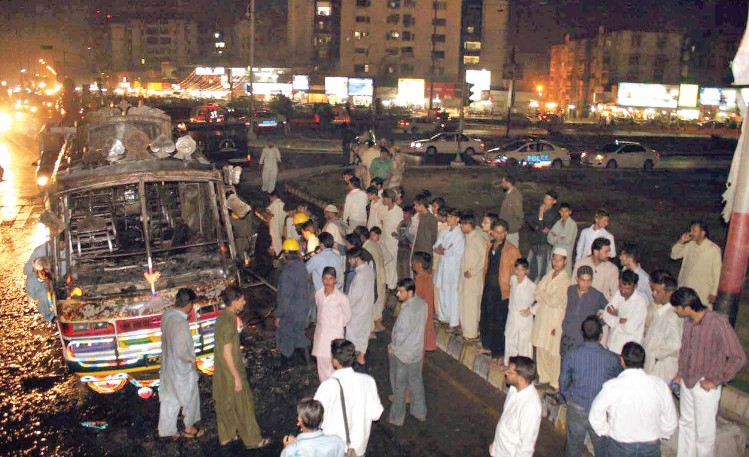 six killed 13 vehicles burnt overnight in karachi