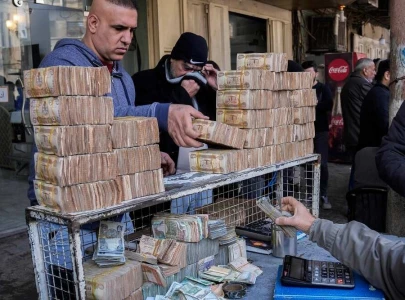 protests in baghdad as iraqi dinar dips against dollar