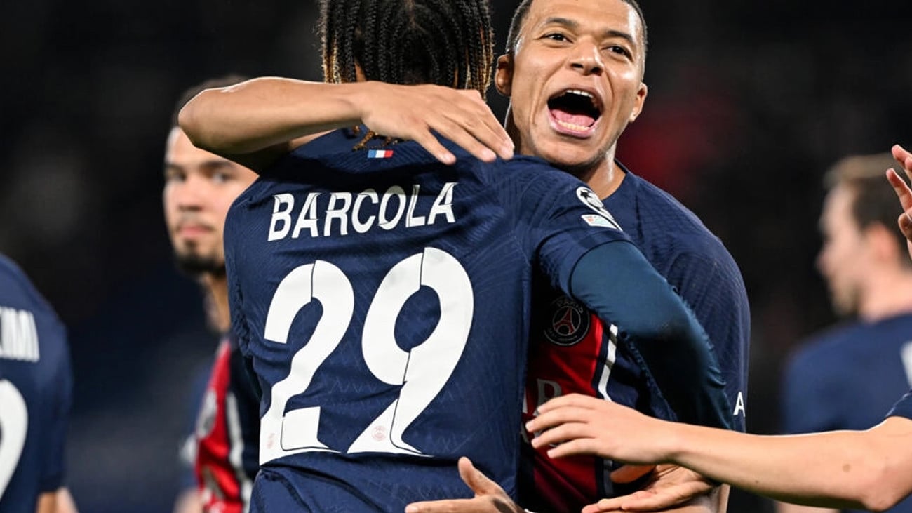 crusing on kylian mbappe and bradley barcola scored the goals as psg beat real sociedad 2 0 in the first leg of their champions league last 16 tie photo afp