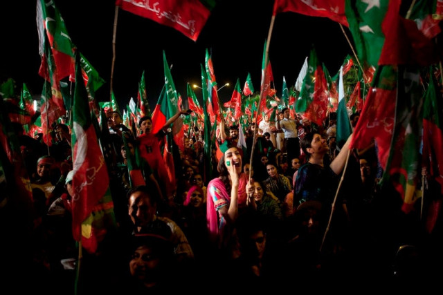 a young woman chants slogans in support of imran khan at a rally for his party pakistan tehreek e insaaf on may 9 2013 in islamabad photo myra iqbal express a young woman chants slogans in support of imran khan at a rally for his party pakistan tehreek e insaaf on may 9 2013 in islamabad photo myra iqbal express