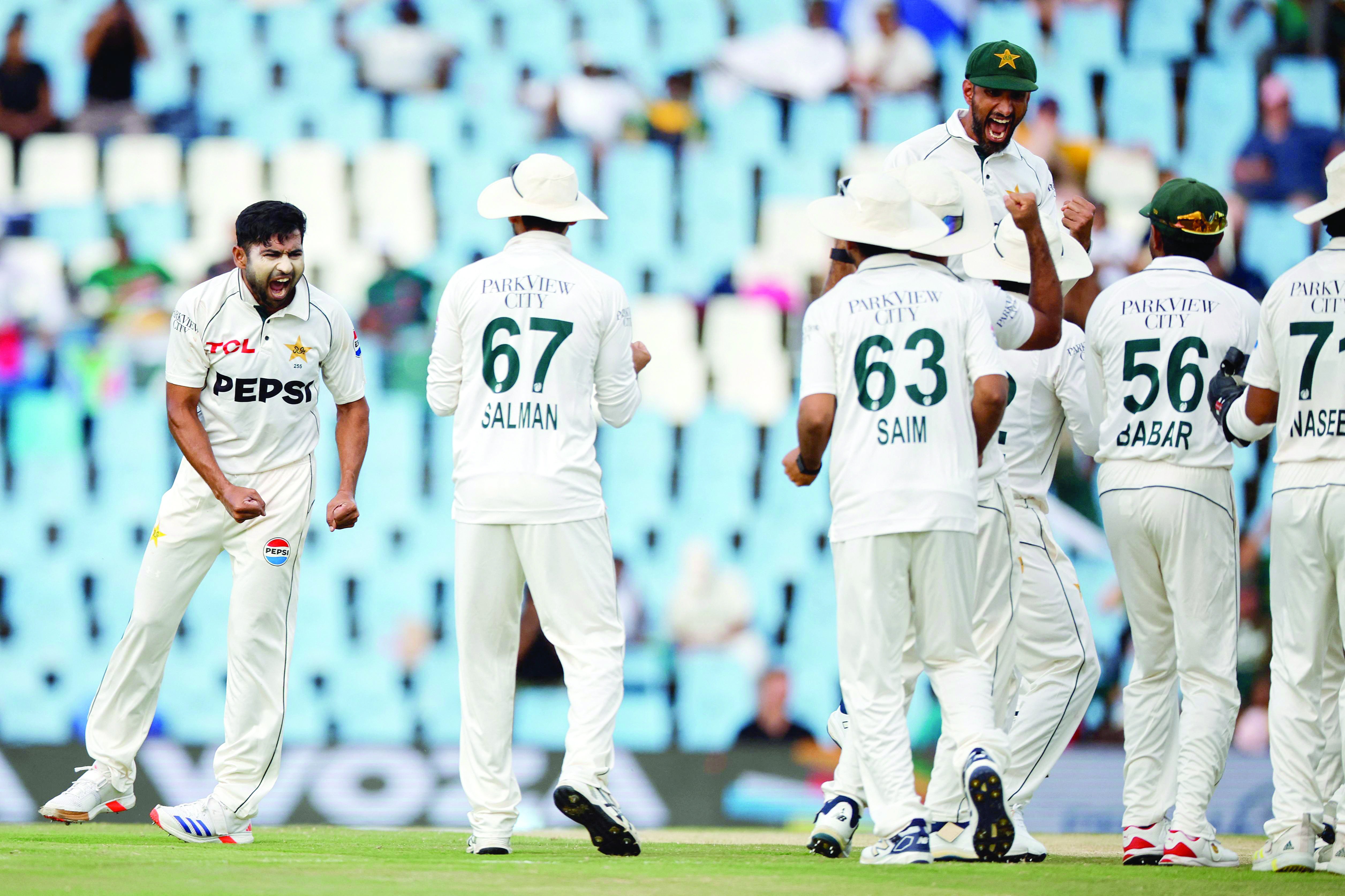 pakistan s khurram shahzad l celebrates with teammates after the dismissal of south africa s ryan rickelton unseen during the third day of the first cricket test match at supersport park in centurion photo afp