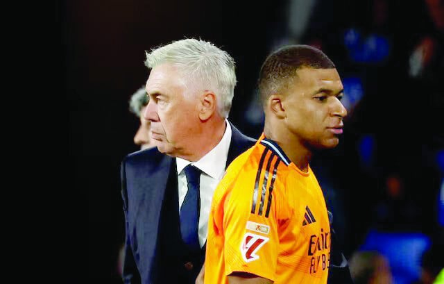 real madrid s kylian mbappe with coach carlo ancelotti after being substituted off during laliga match against real sociedad on september 14 2024 photo reuters