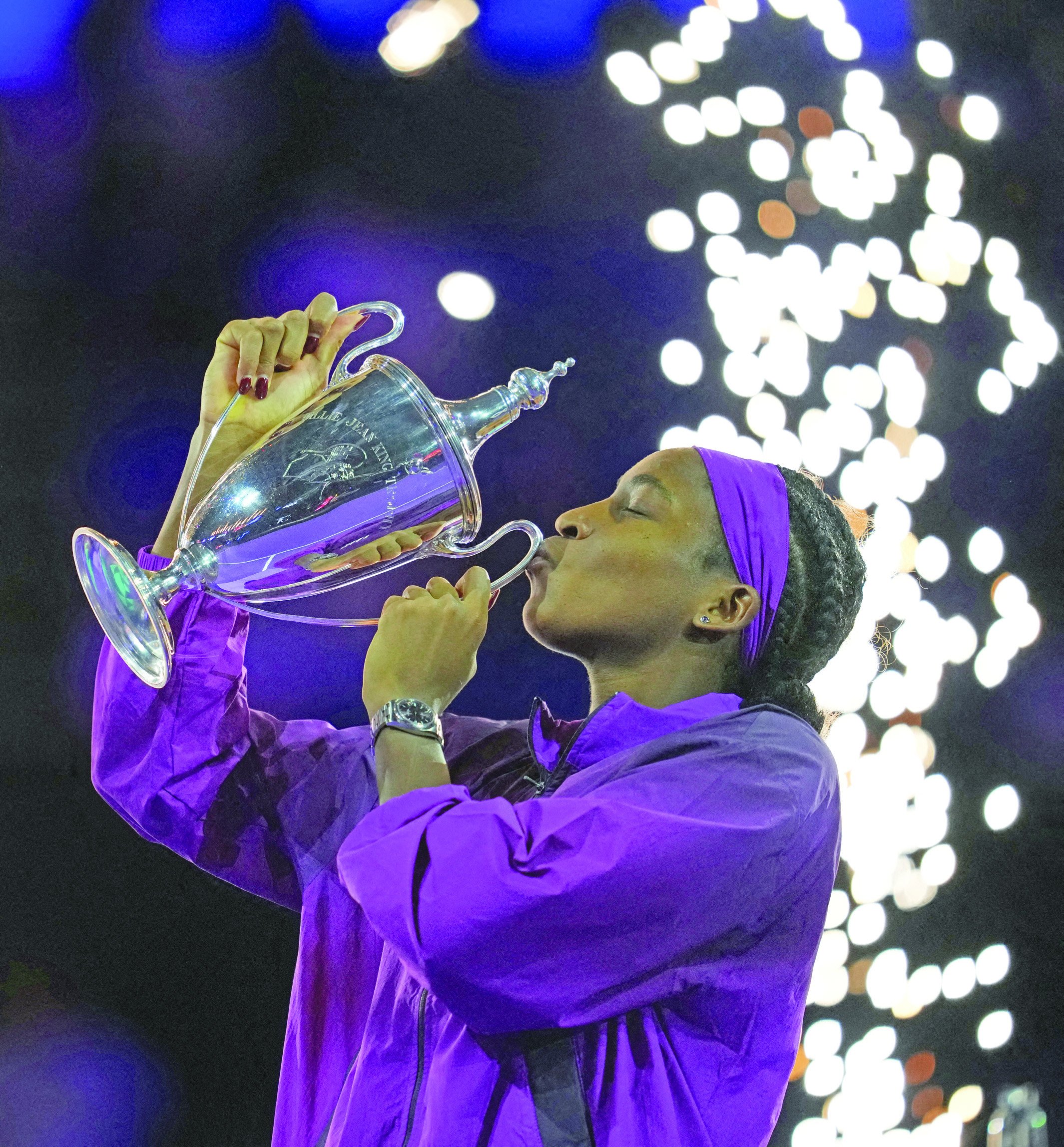 coco gauff of the us celebrates with the trophy after winning the singles wta finals final against china s qinwen zheng in riyadh photo reuters