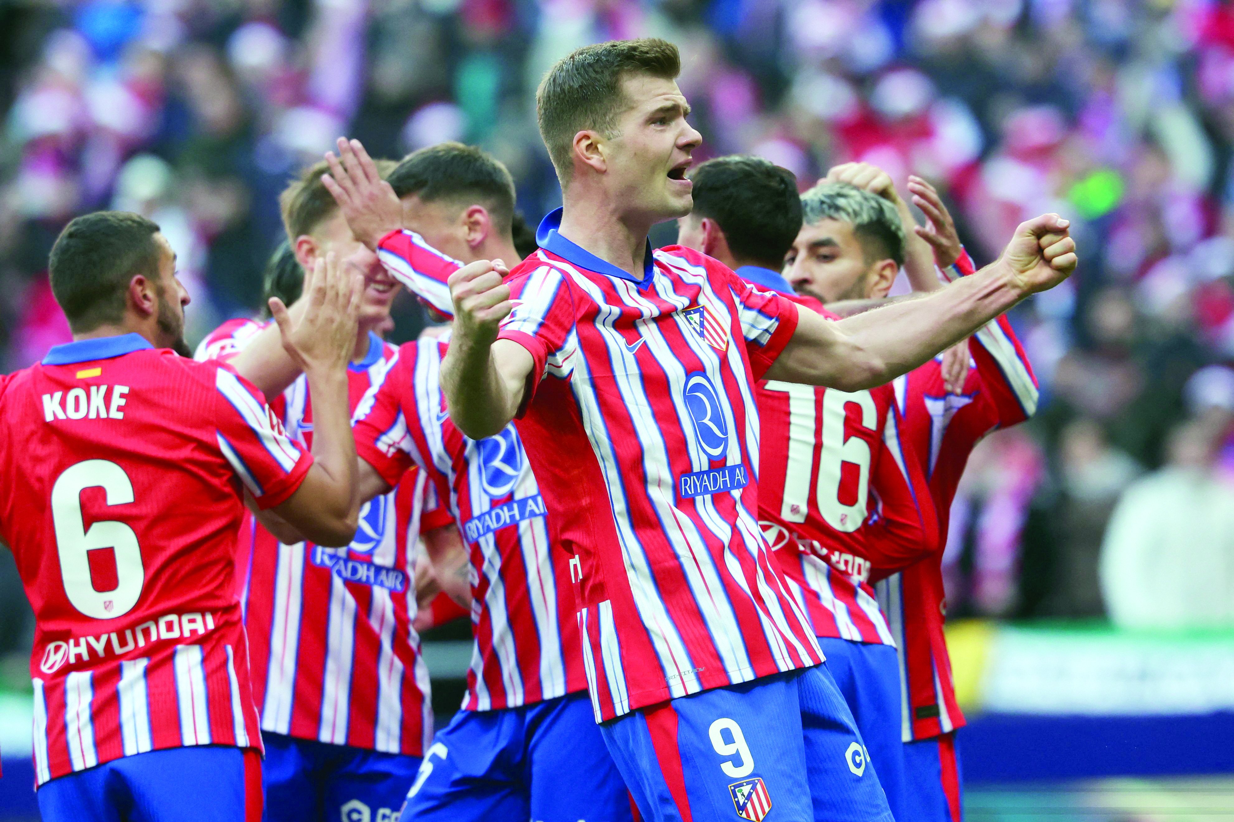 atletico madrid forward alexander sorloth r celebrates after scoring the goal during the spanish league football match against getafe cf at the metropolitano stadium in madrid photo afp