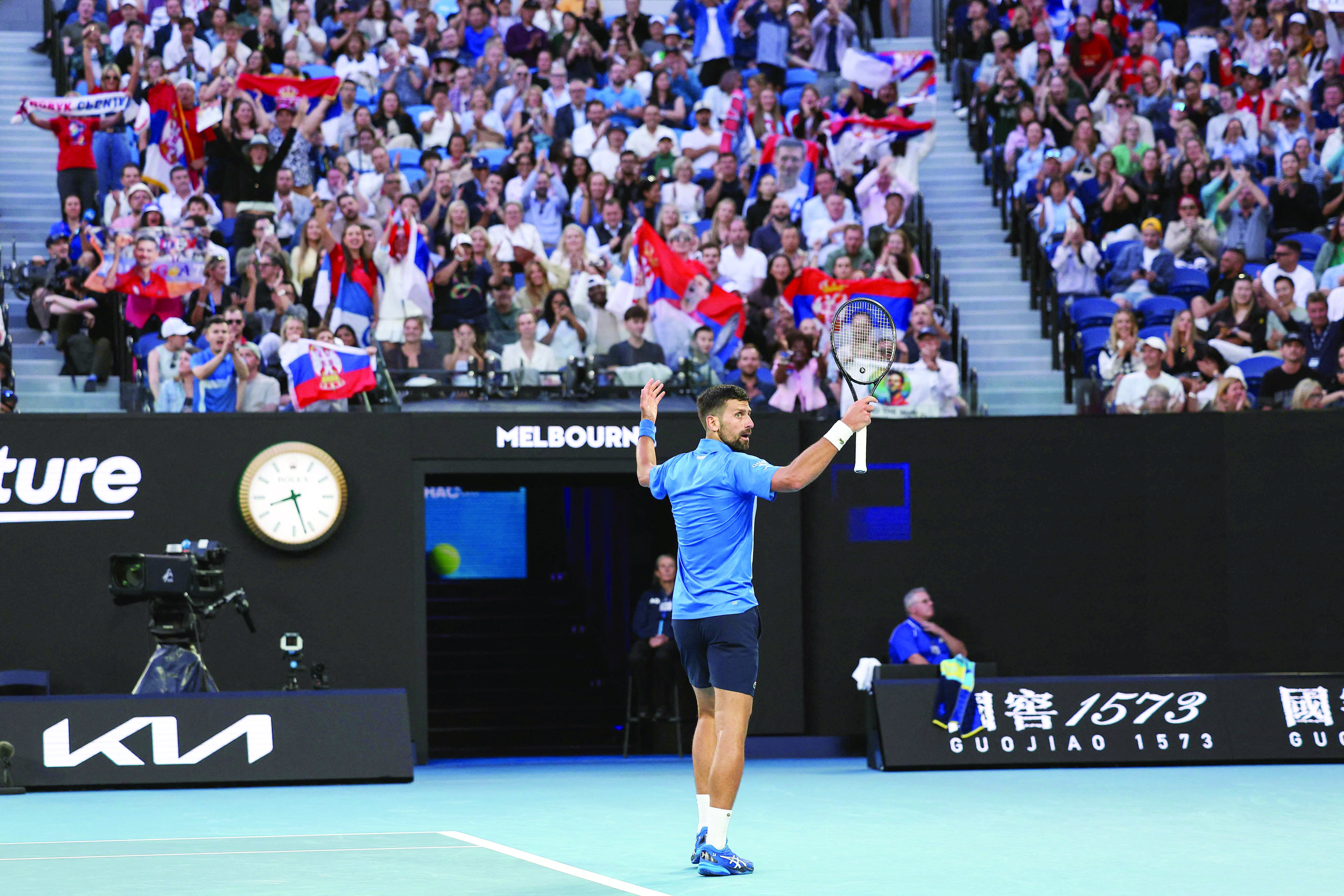 serbia s novak djokovic reacts after a point against czech republic s tomas machac during their match on day six of the australian open tennis tournament in melbourne on january 17 photo afp