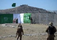 a pakistani soldier keeps vigil at the border fencing along with afghanistan photo afp file