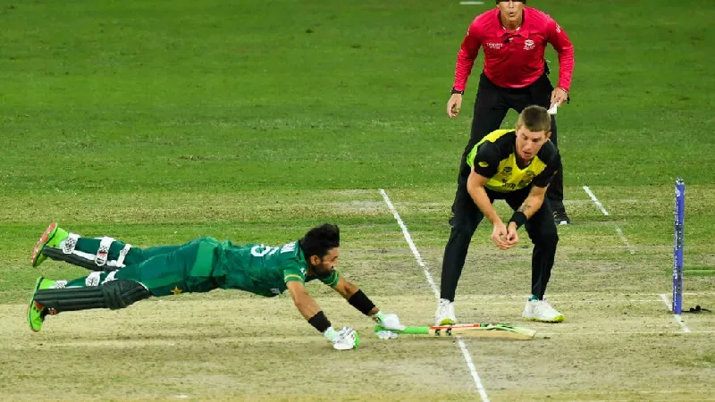 flying tonight mohammad rizwan dives to complete a run in thursday s semi final photo afp