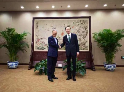 pakistan china vow to further enhance bilateral ties