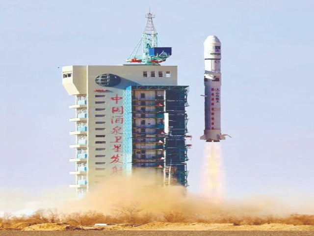 a long march 2d rocket lifts off from jiuquan satellite launch centre in china s gobi desert the rocket carries pakistan s first indigenously built eo 1 satellite and two other satellites photo ppi