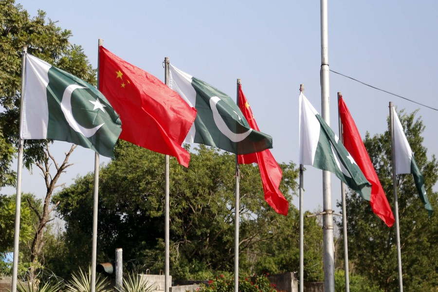pakistani national flags and chinese national flags are raised to celebrate the 74th anniversary of the founding of the people s republic of china by an avenue in islamabad oct 1 2023 photo xinhua