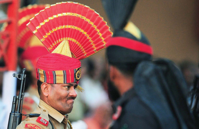 pakistan india agree to tone down flag march