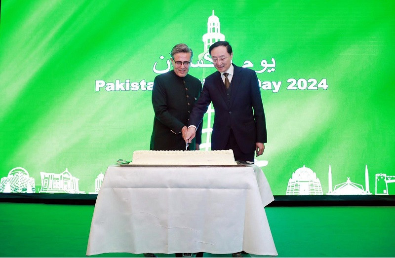 Sun Weidong, Chinese Vice Foreign Minister, and Khalil Hashmi, Pakistan's Ambassador to China, celebrate Pakistan National Day at the Pakistan Embassy in Beijing. PHOTO: APP