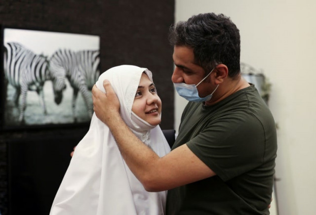pakistani pilgrim bushra shah bids her husband farewell before leaving for the hajj the first time she can do so without a mehram photo afp file pakistani pilgrim bushra shah bids her husband farewell before leaving for the hajj the first time she can do so without a mehram photo afp file