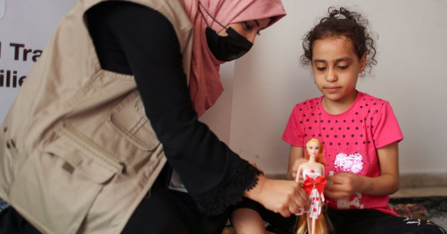 a psychologist plays with palestinian girl suzy eshkuntana who was pulled out from the rubble of her house destroyed by an israeli air strike during israeli palestinian fighting as part of a mental health support session in gaza city june 3 2021 photo reuters a psychologist plays with palestinian girl suzy eshkuntana who was pulled out from the rubble of her house destroyed by an israeli air strike during israeli palestinian fighting as part of a mental health support session in gaza city june 3 2021 photo reuters