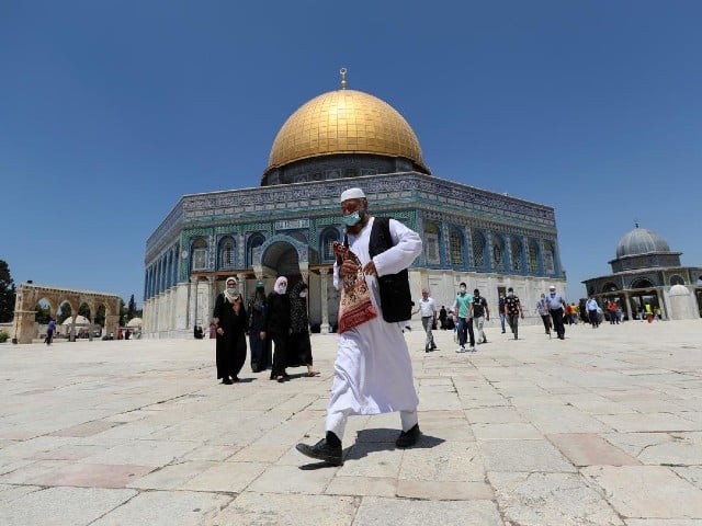 a muslim man walks in front of the dome of the rock on the compound known to muslims as noble sanctuary and to jews as temple mount in jerusalem s old city photo reuters