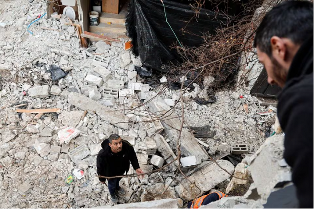 A male stands on rubble after an Israeli raid, during Nour Shams interloper stay in Tulkarm, in a Israeli-occupied West Bank, Jan 18, 2024. PHOTO: REUTERS