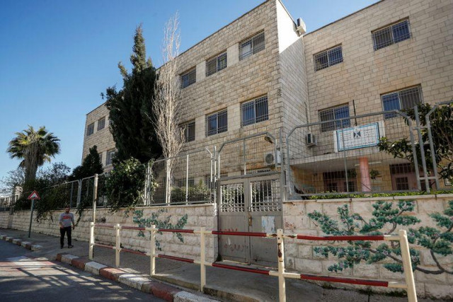 a palestinian man walks past a closed school amid the coronavirus disease covid 19 outbreak in ramallah in the israeli occupied west bank february 27 2021 photo reuters a palestinian man walks past a closed school amid the coronavirus disease covid 19 outbreak in ramallah in the israeli occupied west bank february 27 2021 photo reuters