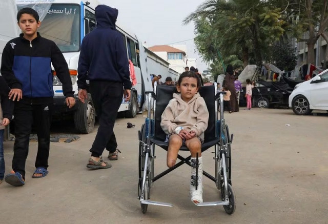 palestinian girl eman al kholi whose limb was amputated after being wounded in an israeli strike december 28 2023 photo reuters