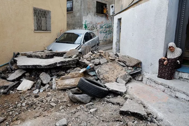 a palestinian woman sits next to a damaged road following an israeli raid in tulkarm in the israeli occupied west bank september 24 2023 photo reuters a palestinian woman sits next to a damaged road following an israeli raid in tulkarm in the israeli occupied west bank september 24 2023 photo reuters