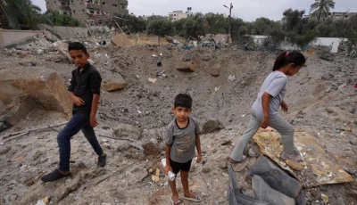 palestinian children near the crater left by an israeli strike in nuseirat in the central gaza strip on june 3 2024 photo afp