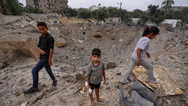 palestinian children near the crater left by an israeli strike in nuseirat in the central gaza strip on june 3 2024 photo afp palestinian children near the crater left by an israeli strike in nuseirat in the central gaza strip on june 3 2024 photo afp