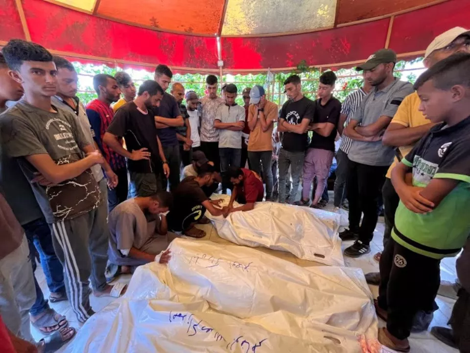 mourners react as they gather around the bodies of palestinians killed in israeli strikes at nasser hospital in khan younis in the southern gaza strip on august 8 2024 photo reuters mourners react as they gather around the bodies of palestinians killed in israeli strikes at nasser hospital in khan younis in the southern gaza strip on august 8 2024 photo reuters