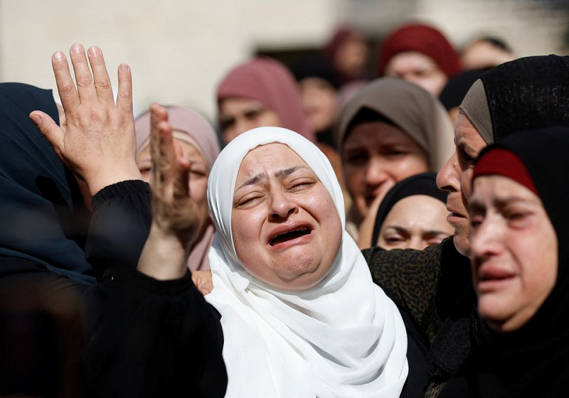 Mourners at the funeral of a Palestinian who was killed by Israeli forces, near Ramallah in the Israeli-occupied West Bank October 19, 2023. PHOTO: REUTERS