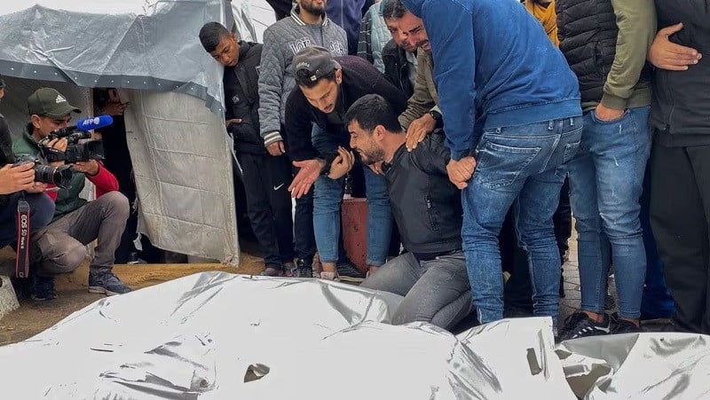 mourners react next to the bodies of palestinians killed in israeli strikes at a hospital in the central gaza strip december 25 2023 photo reuters