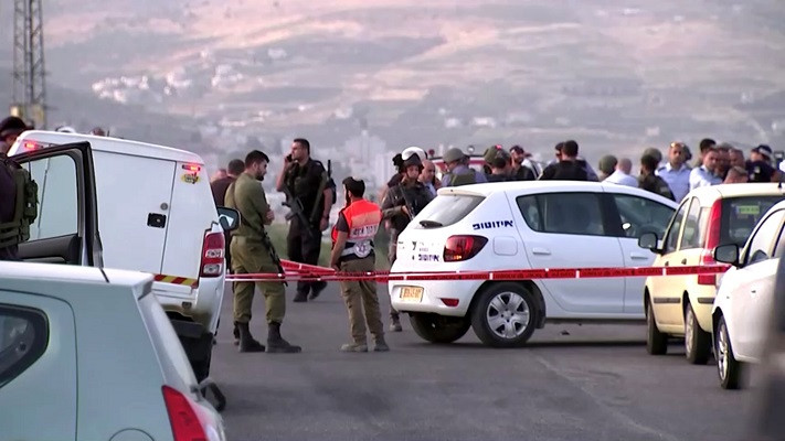 members of israeli forces gather at the scene of a shooting incident in the israeli occupied west bank may 2 2021 in this still image taken from a video photo reuters