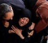a woman reacts next to the bodies of palestinians killed in israeli strikes in rafah in the southern gaza strip april 16 2024 photo reuters