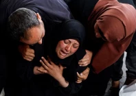 a woman reacts next to the bodies of palestinians killed in israeli strikes in rafah in the southern gaza strip april 16 2024 photo reuters