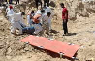 people move bodies of palestinians killed by israel and buried at nasser hospital in khan younis in the gaza strip april 21 2024 photo reuters