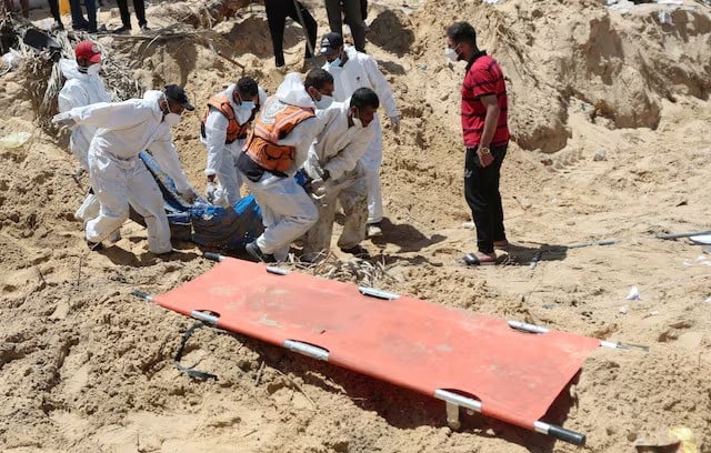 people move bodies of palestinians killed by israel and buried at nasser hospital in khan younis in the gaza strip april 21 2024 photo reuters