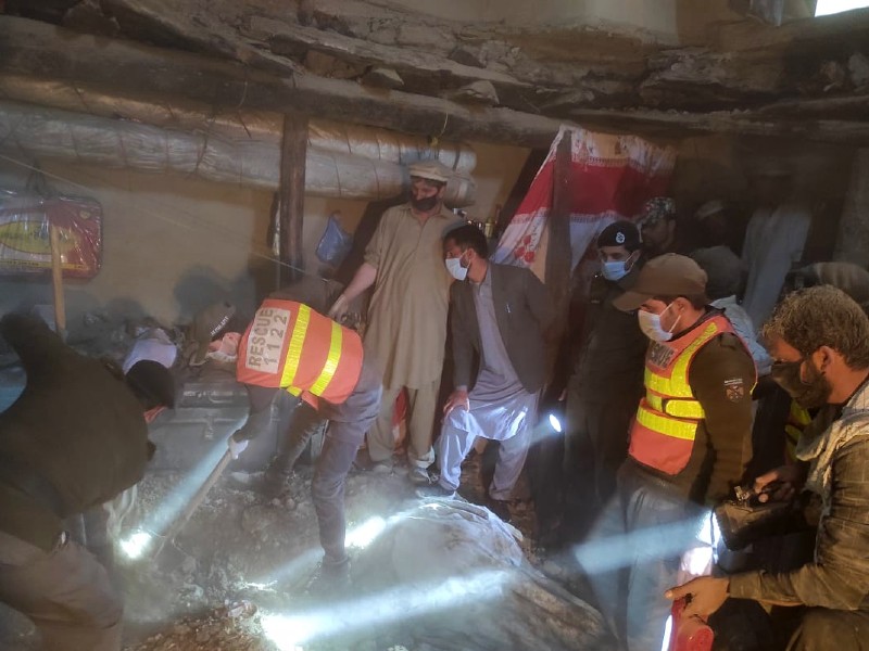 rescus officials searching for people stuck under the debris of the house collapsed in parachinar photo express