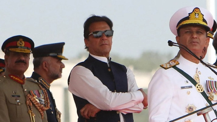 former prime minister imran khan watches pakistan s air force fighter jets perform during the pakistan day parade in islamabad on 23 march 2022 photo afp