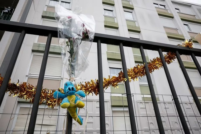 a bunch of flowers is placed on the fence in front of the ground floor flat where the bodies where found in meaux france december 26 2023 photo reuters