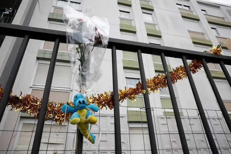a bunch of flowers is placed on the fence in front of the ground floor flat where the bodies where found in meaux france december 26 2023 photo reuters a bunch of flowers is placed on the fence in front of the ground floor flat where the bodies where found in meaux france december 26 2023 photo reuters