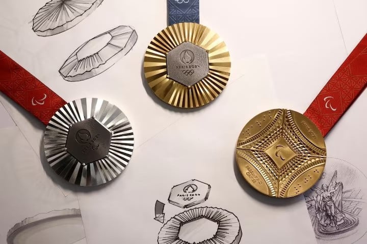 a paris 2024 olympic games gold medal is seen on display with paralympic games gold and silver medals at chaumet jewellery photo reuters