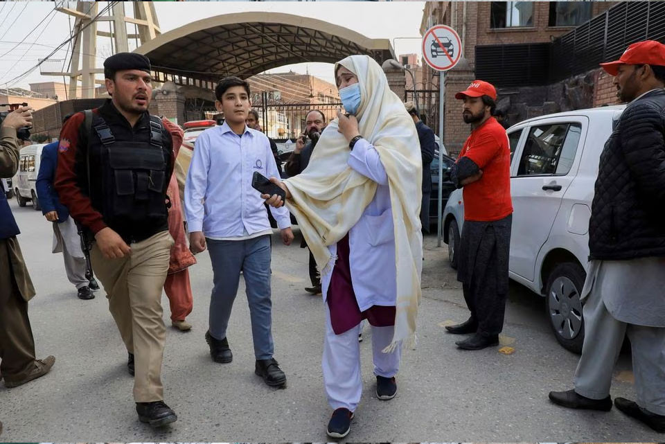  A woman reacts as she searches for her relatives, after a suicide blast in a mosque in Peshawar on Jan 30, 2023.—REUTERS