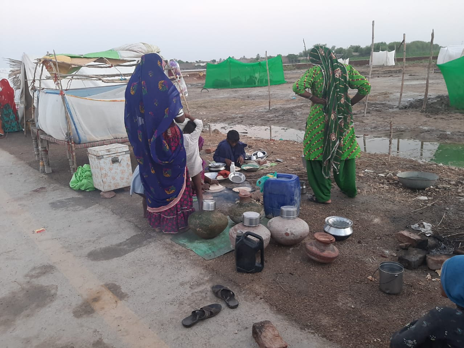 women wait in line at the tent city in umerkot photo sameer mandhro