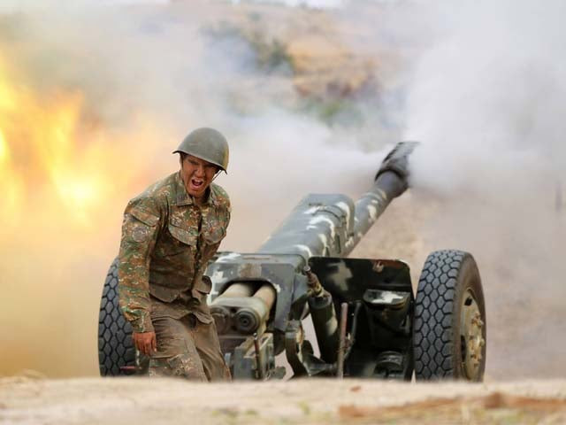 an armenian soldier fires an artillery piece during fighting with azerbaijan s forces photo reuters an armenian soldier fires an artillery piece during fighting with azerbaijan s forces photo reuters
