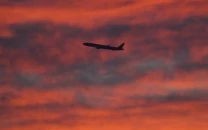 a plane is seen shortly after take off at sunset from heathrow airport london britain december 11 2020 photo reuters file
