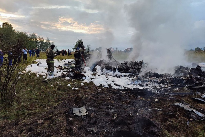 A handout photograph taken and released by Russian Investigative Committee on August 23, 2023, shows rescuers working at the site of a plane crash near the village of Kuzhenkino, Tver region. PHOTO: AFP
