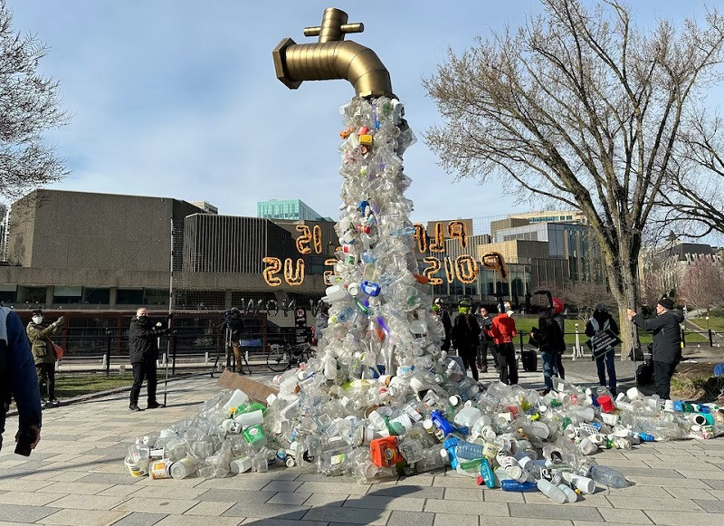 A prop depicting a water tap with cascading plastic bottles is displayed by activists near the Shaw Centre venue of penultimate negotiations for the first-ever global plastics treaty, in Ottawa, Ontario, Canada April 23, 2024.  PHOTO: REUTERS