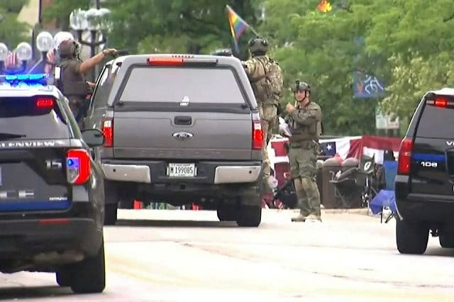 police deploy after gunfire erupted at a fourth of july parade route in the wealthy chicago suburb of highland park illinois us july 4 2022 in a still image from video photo reuters police deploy after gunfire erupted at a fourth of july parade route in the wealthy chicago suburb of highland park illinois us july 4 2022 in a still image from video photo reuters