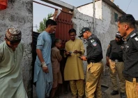 police officers nadra workers check the id cards of afghan citizens in an afghan camp on the outskirts of karachi november 21 2023 photo reuters
